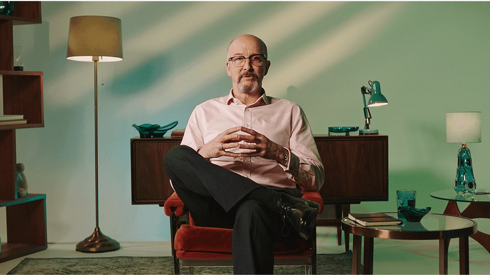 An expert seated in a warm, calm studio living room