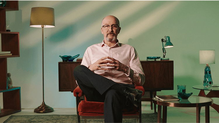 An expert in a calm studio, where the research conversations happen