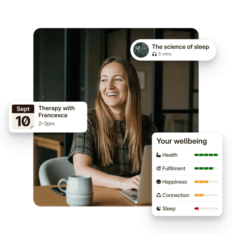 A smiling woman at a table, wellbeing cards floating beside her