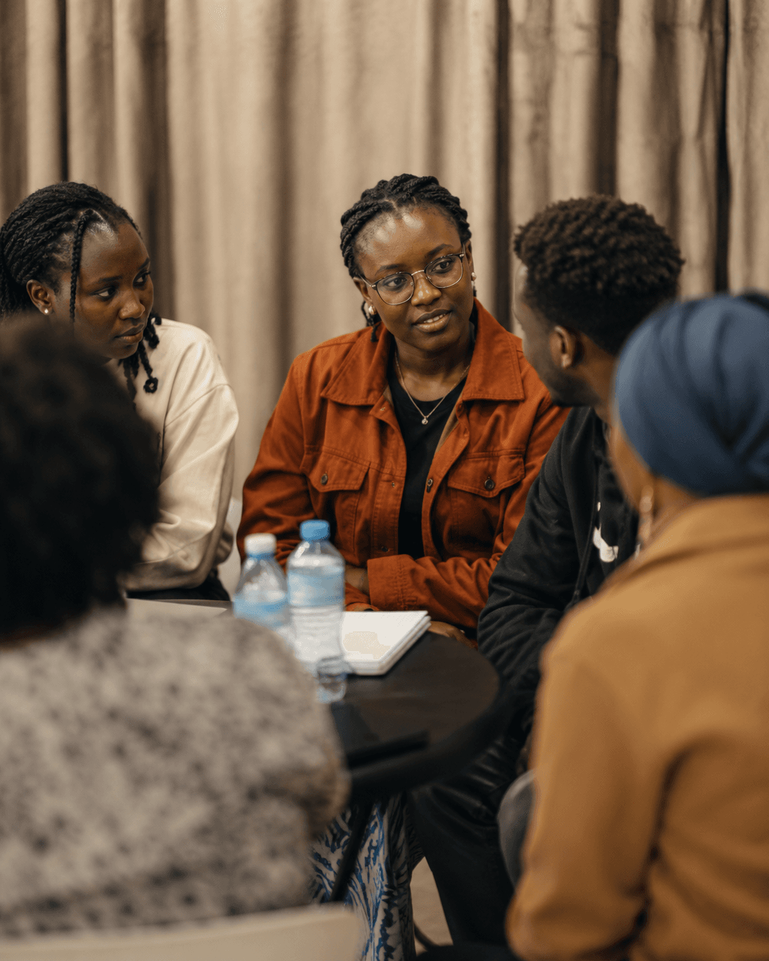 People in conversation together at a Heyrafiki session